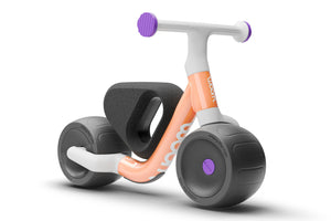 Woom WOW pop peach ultralight self-balancing balance bike.