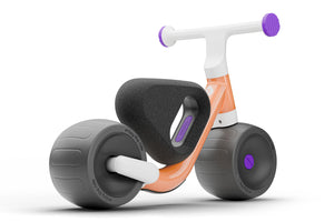 Woom WOW pop peach ultralight self-balancing balance bike.