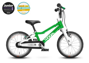 Award winning Woom 2 green 14 inch wheel ultralight children's bike.
