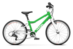 Woom 4 green 20 inch wheel 7 speed ultralight hybrid bike.