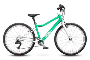 Woom 5 mint green 24 inch wheel 8 speed ultralight hybrid bike.