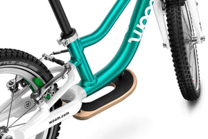 Woom GO 1 PLUS balance bike standard fitment surfboard footrest.