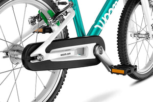 Woom GO 2 compact fully-enclosed chainguard.
