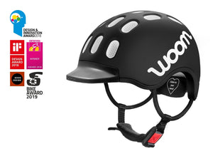 Award-winning Woom matt black kids helmet.