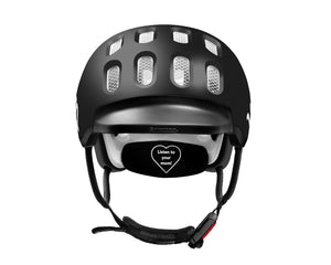 Front view of the Woom matt black kids helmet showing rubber visor and Fidlock® magnetic closure system.