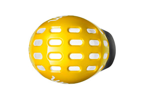 Top view of the Woom sunny yellow kids helmet showing an array of vents for cooling.