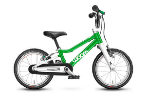 Woom 2 green 14 inch wheel ultralight children's bike.
