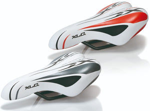 XLC white and red junior saddle.
